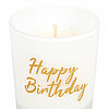 Ein weißes Teelicht in einem transparenten Glasbehälter. Auf dem Glas steht in goldener Schrift "Happy Birthday". Das Teelicht ist nicht angezündet.
